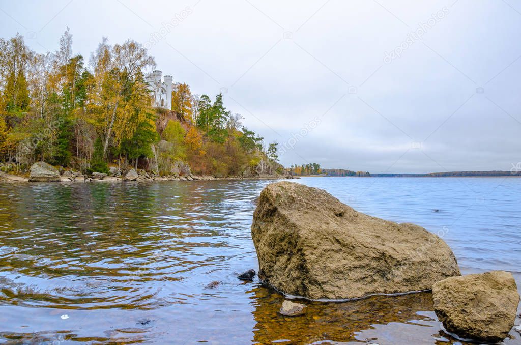 Autumn landscape on the rocky shore of the lake