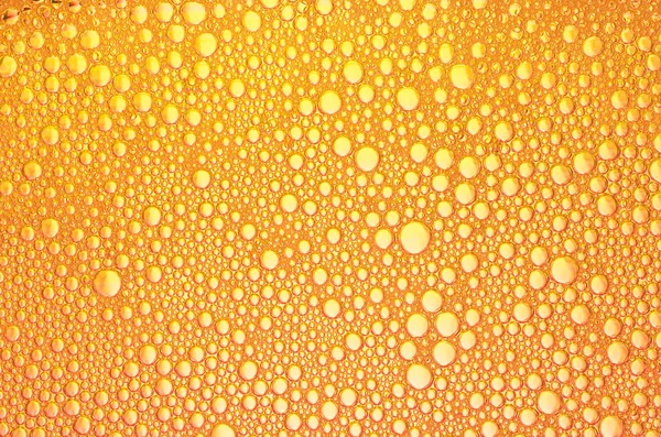 The orange bubbles on the surface of the liquid — Stock Photo, Image