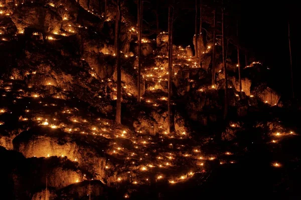 Small fires in a rocky hill with trees during a light celebration in the Frankonian Alb, Southern Germany. — Stock Photo, Image