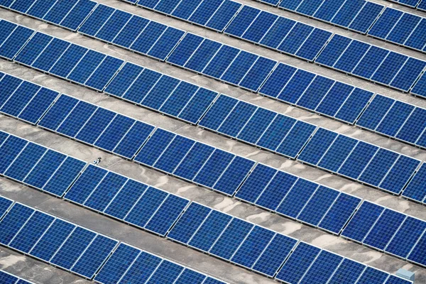 Solar panels installed on building roof — Stock Photo, Image