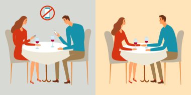 Ve telefonu olmayan bir restoranda oturan Çift.