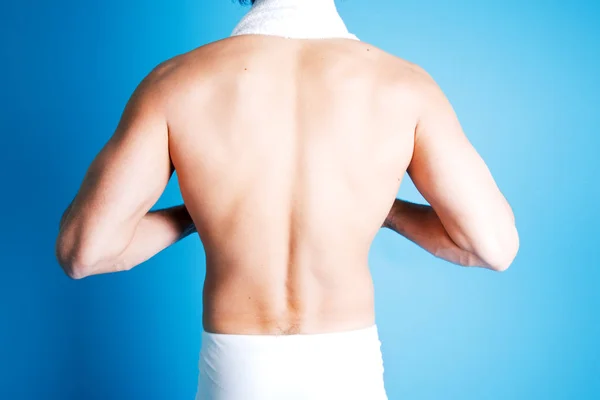 shirtless male back with towel