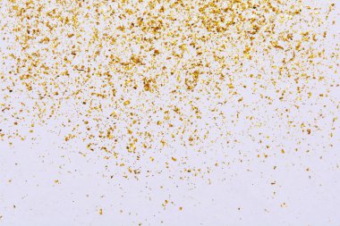 Golden glitter texture on white abstract background
