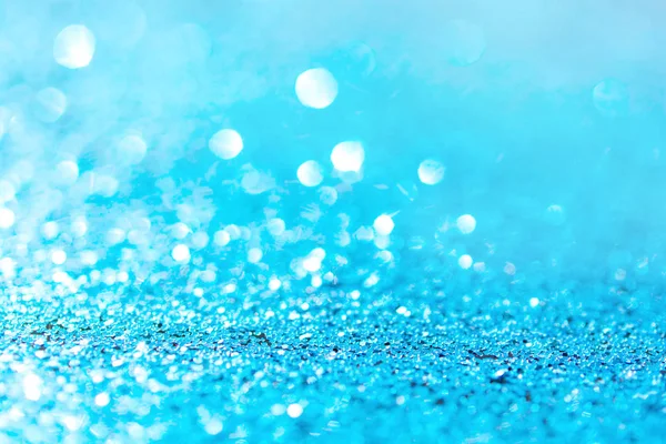 Defokussierter blauer Glitzerhintergrund. blauer abstrakter Bokeh-Hintergrund — Stockfoto