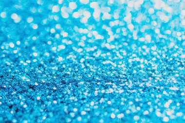 Defocused blue glitter background. blue abstract bokeh backgroun