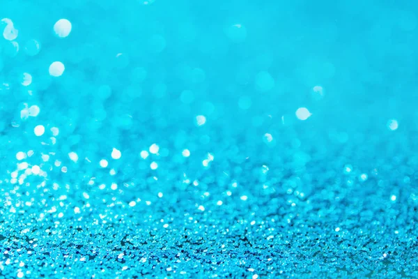 Defocused blue glitter background. blue abstract bokeh backgroun