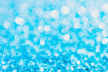 Defocused blue glitter background. blue abstract bokeh backgroun