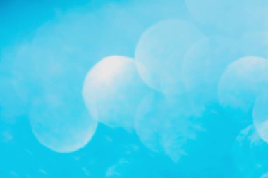 Defocused blue glitter background. blue abstract bokeh backgroun