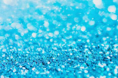 Defocused blue glitter background. blue abstract bokeh backgroun