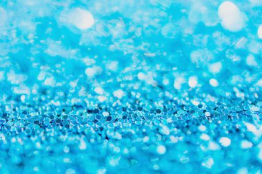 Defocused blue glitter background. blue abstract bokeh backgroun
