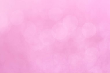 Abstract defocused lights pink tone lights background.