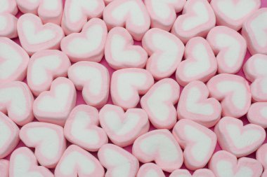 Pink heart shaped marshmallows background