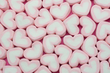 Pink heart shaped marshmallows background