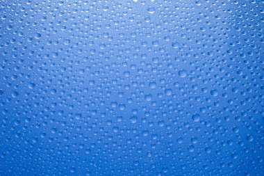 Water drops blue background. Water drops on glass background