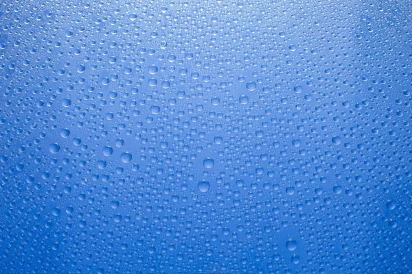 Water Druppels Blauwe Achtergrond Waterdruppels Glazen Ondergrond — Stockfoto
