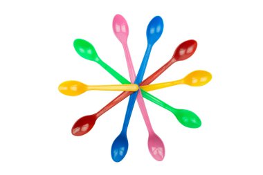 colorful plastic spoons for party isolated on white