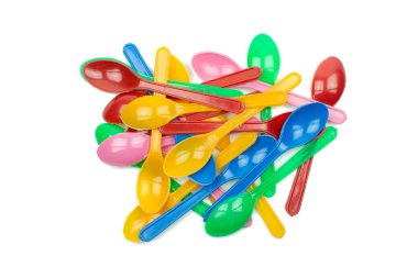 colorful plastic spoons for party isolated on white