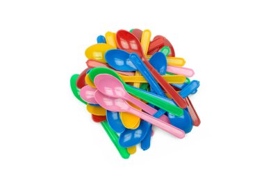 colorful plastic spoons for party isolated on white