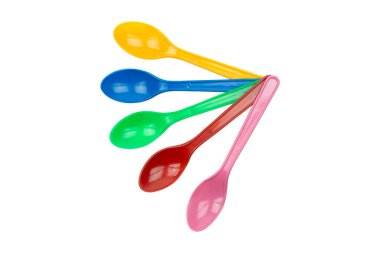 colorful plastic spoons for party isolated on white