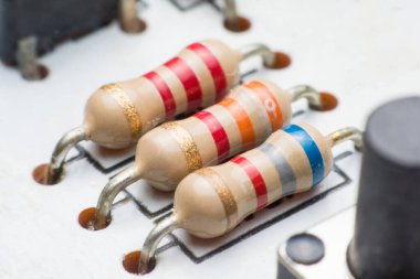 Closeup electronic hardware .Resistor on the circuit board clipart
