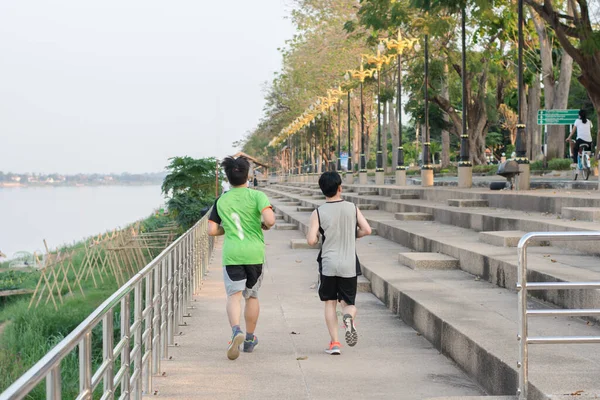 Two Young Athletes Jogging Running Riverside — Stock Photo, Image