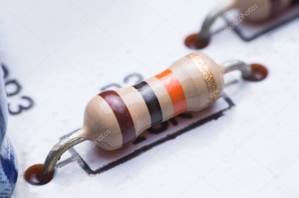 Closeup electronic hardware .Resistor on the white circuit board