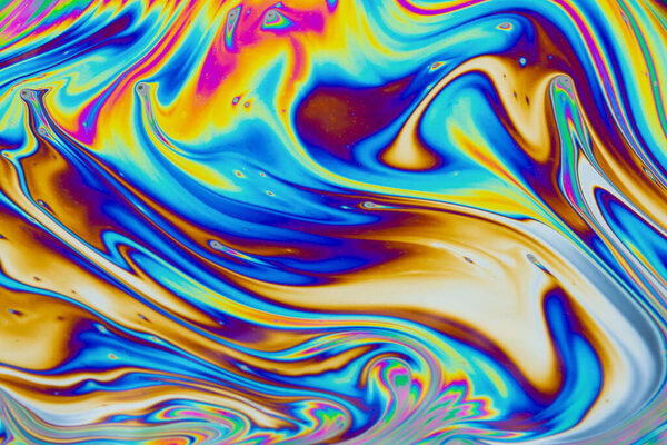 Psychedelic multicolored patterns background. Photo macro shot of soap bubbles