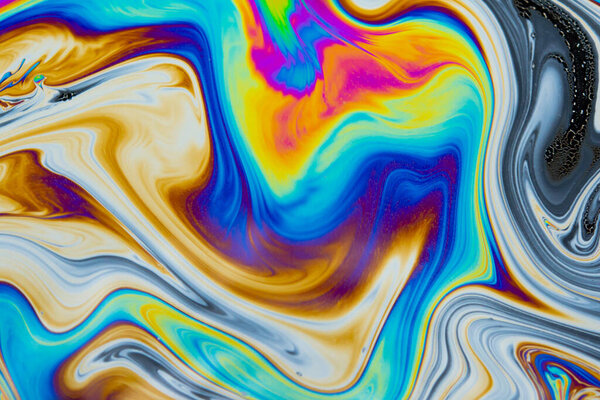 Psychedelic multicolored patterns background. Photo macro shot of soap bubbles
