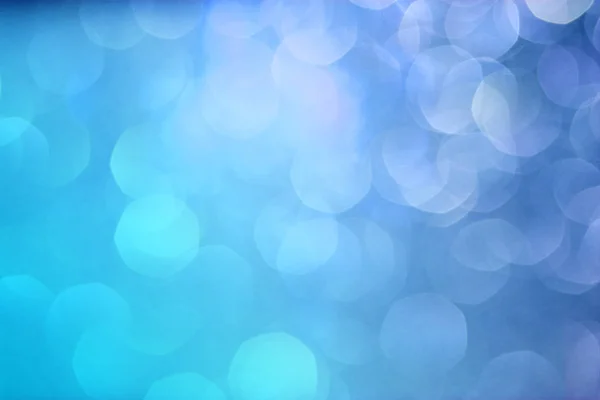 Blauer Bokeh-Hintergrund. Blaues Weihnachtslicht. Neujahrsbokeh mit Gefälle. — Stockfoto