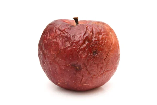 Old dry ribbed red apple, rotted, natural texture — Stock Photo, Image