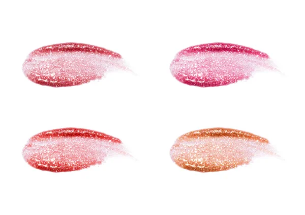 Brillos labiales diferentes aislados en blanco. Muestra de brillo labial manchado . —  Fotos de Stock