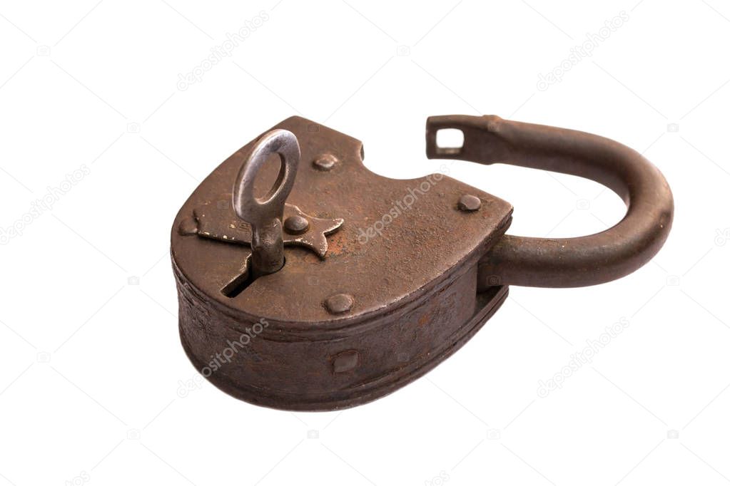 Old rusty opened padlock isolated on white background, key in the lock.