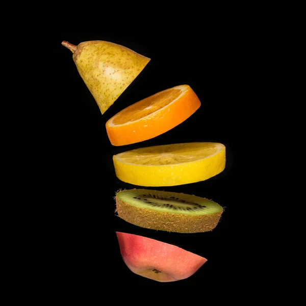 Creative concept with flying fruit. Pear, orange, lemon, kiwi, apple — Stock Photo, Image