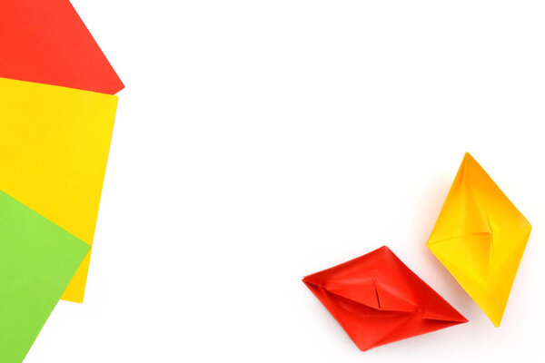 Yellow and red paper boats, origami, paper sheets, color paper sheets