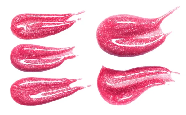 Set of different lip glosses smear isolated on white. Smudged makeup product sample. — Stock Photo, Image