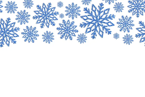 Karácsonyi keret kék hópelyhek. Flitter konfetti határán — Stock Fotó