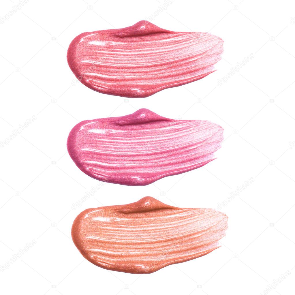 Set of different lip glosses smear samples isolated on white