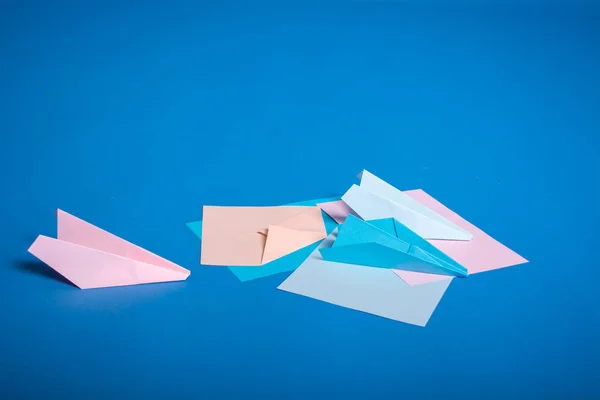 Place for making origami paper planes. Blue, blue, pink origami airplanes crafts — Stock Photo, Image