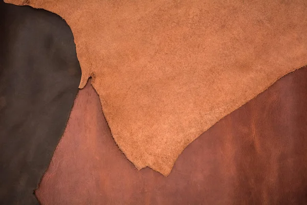 Üç adet doğal kahverengi deri dokusuna. Deri arka plan.