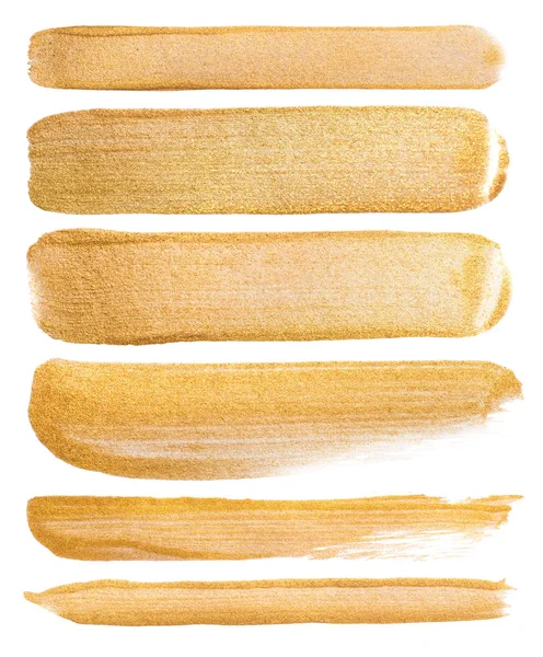 beyaz zemin üzerine suluboya altın smear kümesi. El vuruşları boyalı