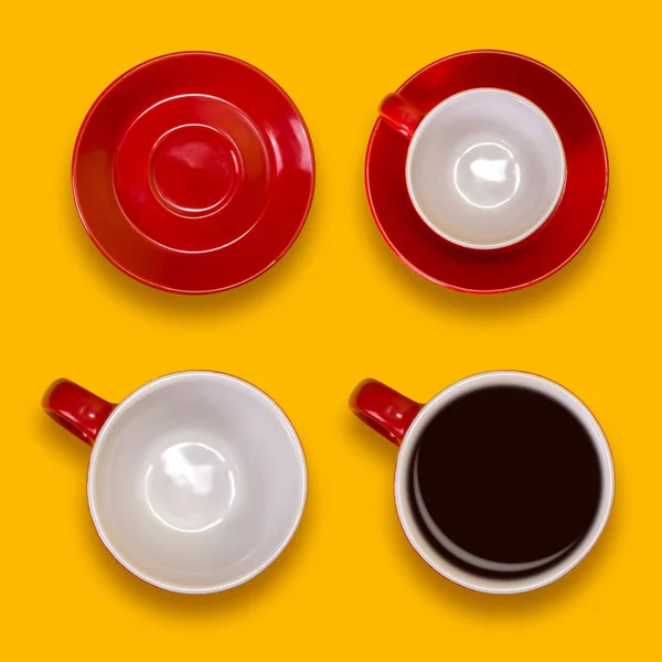 Set of empty and full red cups and a saucers. Coffee set on a yellow background — Stock Photo, Image