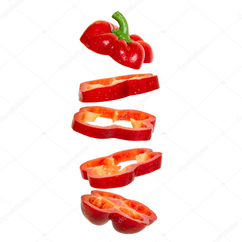 Creative concept with flying red paprika Sliced floating pepper. Levity capsicum