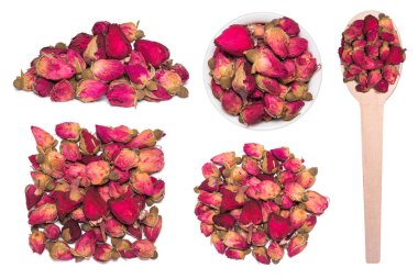 Çay kuru gül tomurcukları beyaz izole büyük kümesi. Tahta kaşık kuru gül