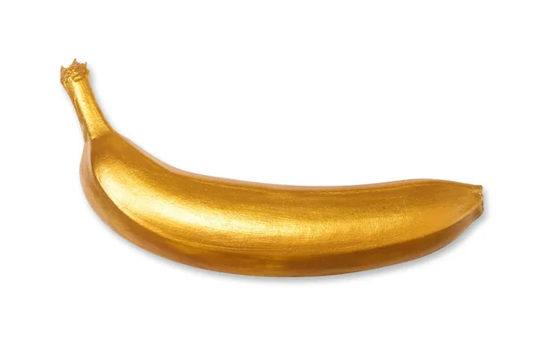 Banana dourada isolada sobre um fundo branco. Conceito criativo com fruta — Fotografia de Stock