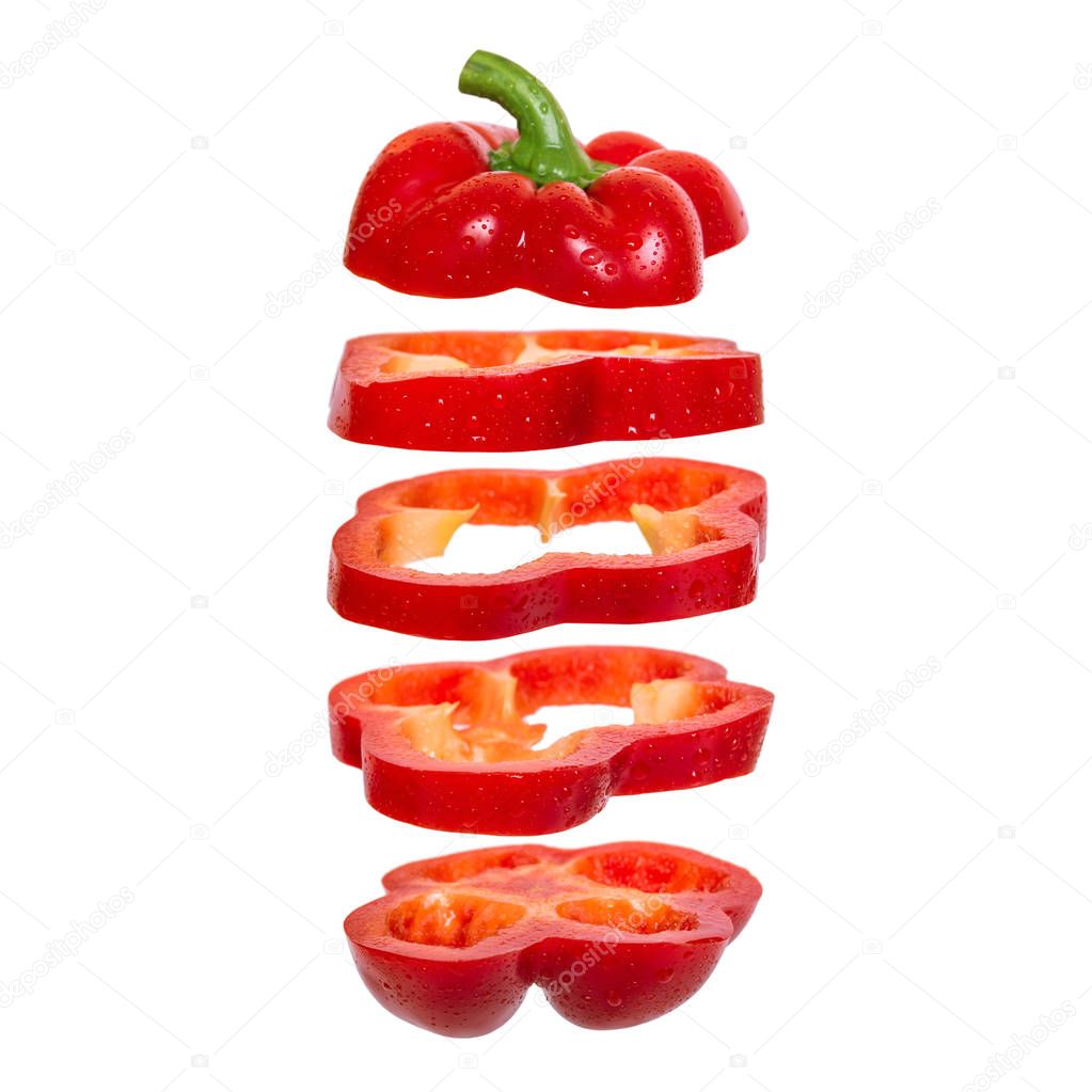 Creative concept with flying red paprika.Sliced floating pepper. Levity capsicum