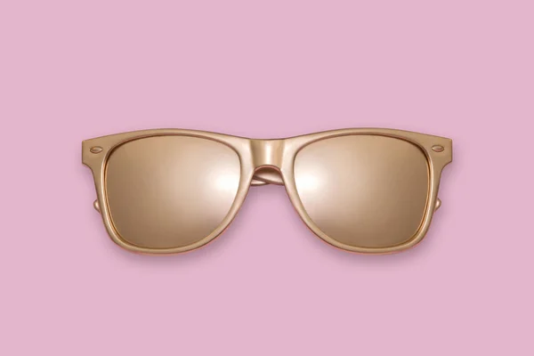 Zlaté sluneční brýle na růžovém pozadí. Kreativní koncept, současného umění. — Stock fotografie