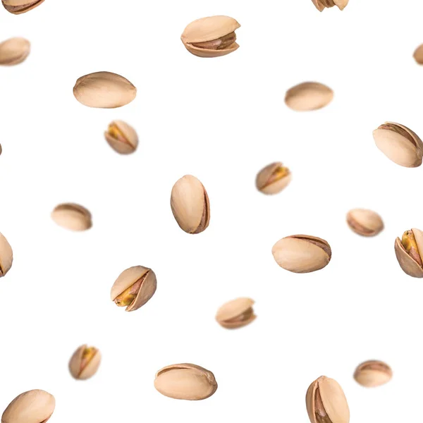 Seamless pattern with falling pistachio nuts isolated on white background. Levity kernels. — Stock Photo, Image