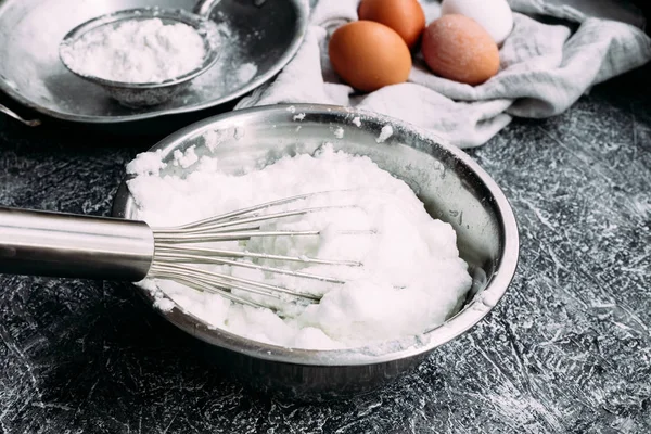 Whipped egg white into a thick foam. Plate with egg whipped white,whisk, meringue