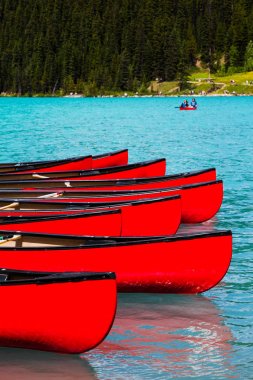 Canoes at Lake Louise, Banff National Park, Canada clipart