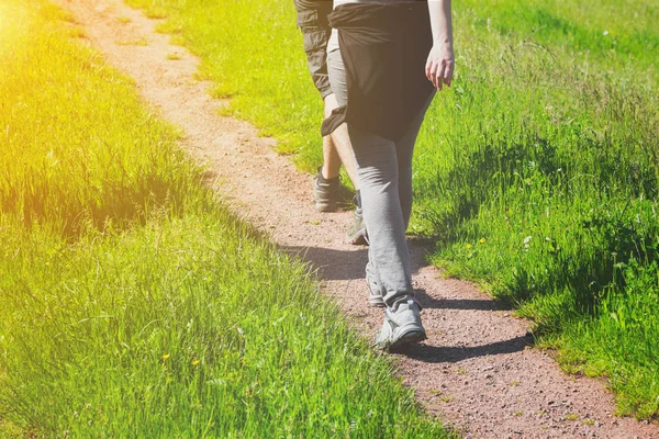 Young people walking along a rural farm track